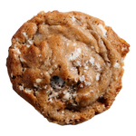 A single cookie with visible chunks of banana, marshmallows, and white chocolate chips, sprinkled with sugar on top.